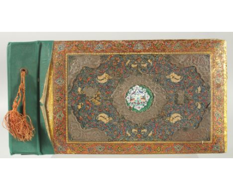 A PERSIAN METAL MOUNTED PAINTED WOODEN ALBUM, with central inset enamel panel painted with flora and fauna, 30cm x 15.5cm.