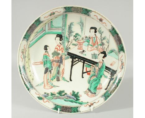 A CHINESE KANGXI FAMILLE VERTE PORCELAIN DISH, painted with female figures, 29cm diameter.