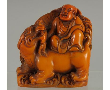 A CHINESE FIGURAL SEAL OF LOHAN, 9.5cm high.