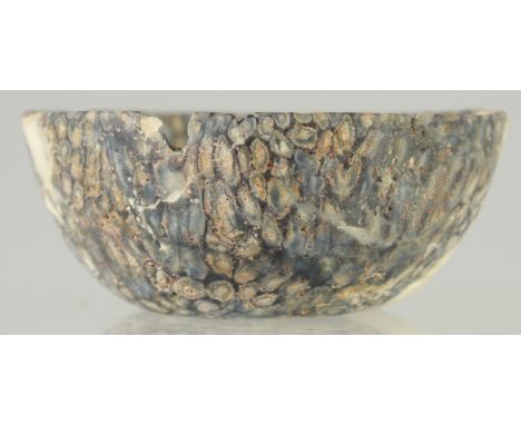 A RARE EARLY ISLAMIC MOSAIC GLASS BOWL, (af), 9.5cm diameter.