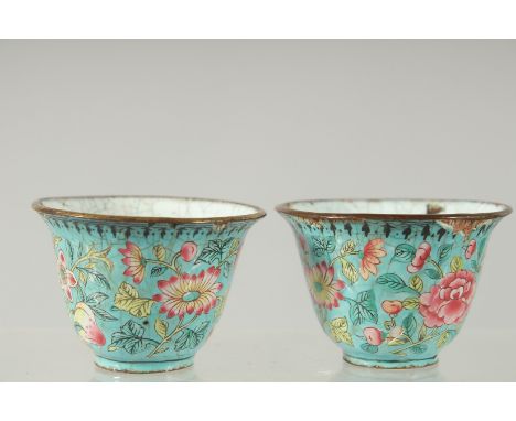 A PAIR OF CHINESE CANTON FAMILLE ROSE ENAMEL CUPS, 6cm diameter.
