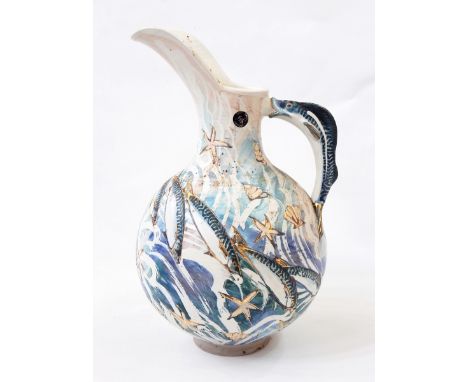 Ceramic ewer with fish and shell decoration, fish handle, 40cm high 
