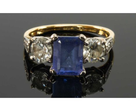 18CT YELLOW GOLD & PLATINUM TANZANITE & DIAMOND THREE STONE RING, the central claw set rectangular tanzanite (7 x 6mms approx
