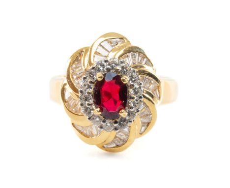 18CT PRESUME RHODOLITE GARNET & DIAMOND RING, oval stone withing halo and flower petal borders, gross wt 6.8gProvenance: dece
