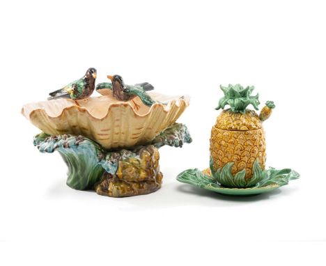 CONTINENTAL MAJOLICA CLAM SHELL BOWL, with two birds perched on the rim, 38cms W, and a Portuguese pineapple jar, cover, stan