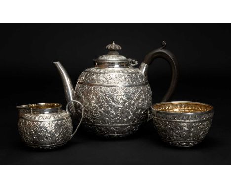 VICTORIAN THREE PIECE SILVER TEA SERVICE, Charles Boyton, London 1884, comprising teapot, cream jug and sucrier, decorated in