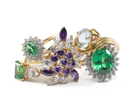 FIVE DRESS RINGS, including 9ct single stone presumed pale aquamarine, three 9ct simulated emerald and cz rings, and an ameth