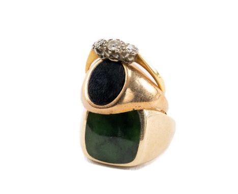 TWO 9CT GOLD RINGS comprising one set with green hardstone and another set with onyx, 12.1gms gross together with 18ct gold a