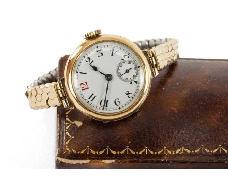 15CT GOLD LONGINES LADIES' WRISTWATCH, white enamel Arabic dial with subsidiary seconds, red '12', 18J signed manual wind mov