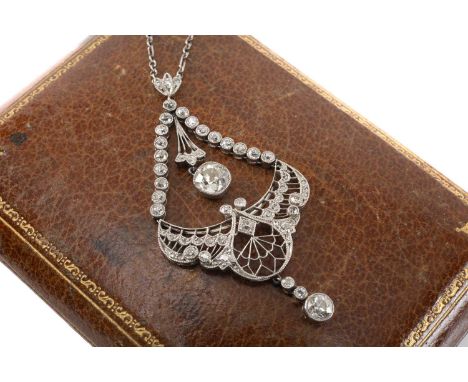 ANTIQUE DIAMOND ENCRUSTED PENDANT of openwork design, diamond suspension above winged body, triple diamond drop with central 