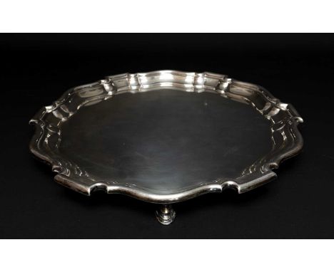 GEORGE V SILVER SALVER, of circular shape with shaped rim, raised on three feet, Sheffield 1919, Mappin & Webb, 39ozt approx.