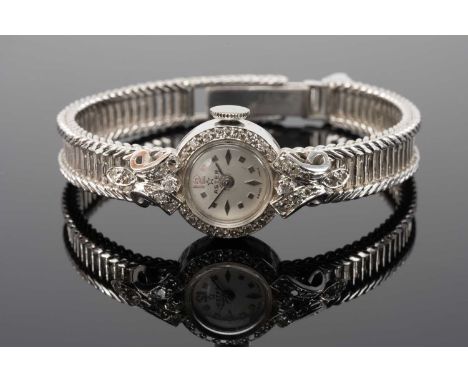 18CT WHITE GOLD ASTER LADIES COCKTAIL WRISTWATCH, with diamond encrusted bezel and scroll mounts, integrated ladder design br