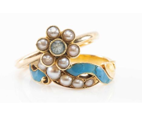 TWO YELLOW METAL RINGS comprising a 9ct gold aquamarine and seed pearl flowerhead ring, and a yellow metal blue enamel and se