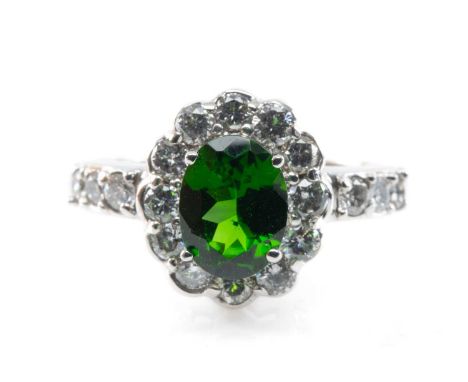14CT WHITE GOLD PRESUMED CHROME DIOPSIDE RING, oval stone above 12 diamond surround, and triple diamond shoulders, gross wt 4