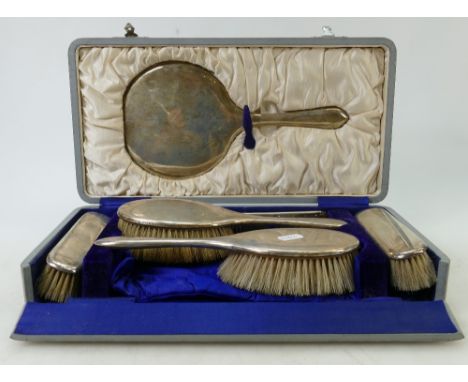 Silver backed dressing table set: Cased six piece hallmarked silver dressing table set comprising mirror, 2 pairs of brushes 