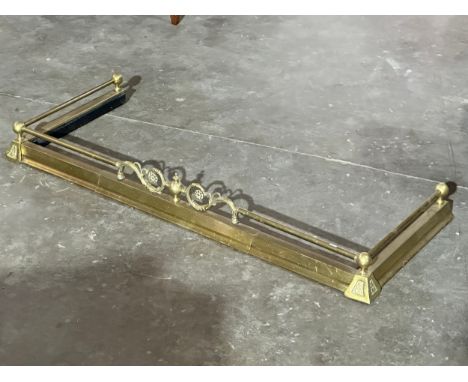 A large vintage brass fender.