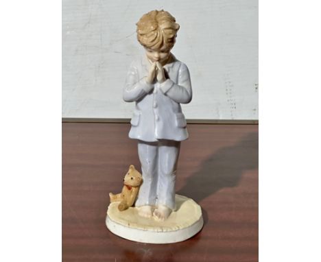 A Royal Worcester I Pray figurine.