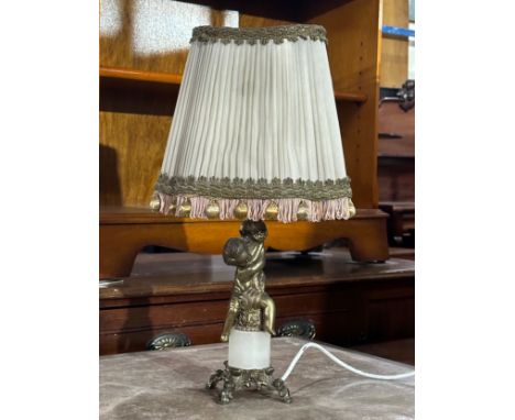 A vintage brass and onyx cherub table lamp. 49cm