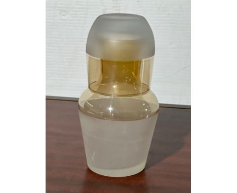 A vintage bedside carafe and glass.