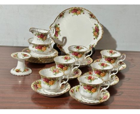 22 pieces of Royal Albert Old Country Roses. A 21 piece tea service and a candleholder.