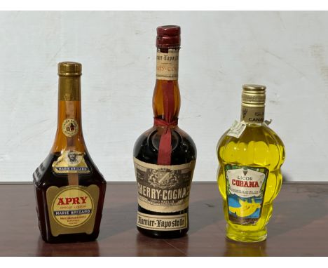 4 bottles of alcohol. Apry, Cherry Cognac, Licor Cobana.