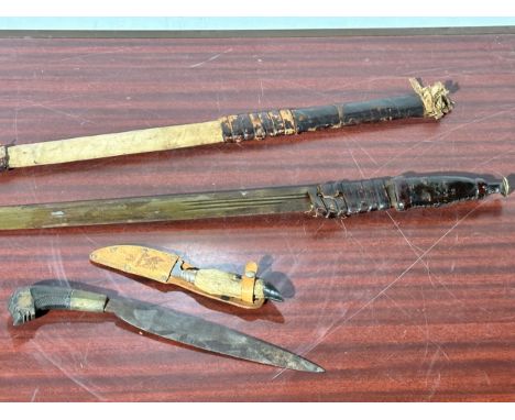 A 19th century Far Eastern sword, dagger and 2 vintage daggers