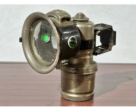 An early 20th century Miller bicycle lamp.