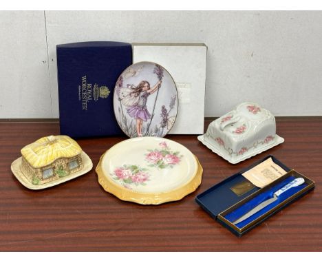 A job lot of pottery. A Royal Worcester The Lavender Fairy plate with box. A cheese dish and butter dish. An Edwardian cake p