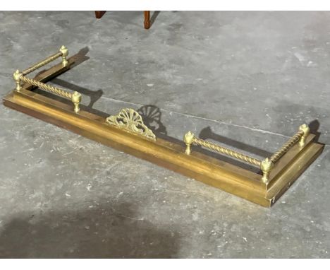 A large vintage brass fender.