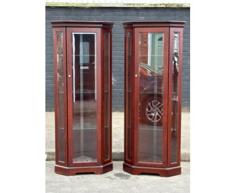 A pair of mahogany light up corner display cabinets. 186cm