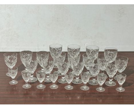A set of 26 vintage Bohemian crystal pinwheel cut port and sherry glasses. 12cm. 8cm