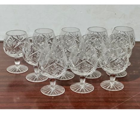A set of 12 vintage Bohemian crystal pinwheel cut brandy glasses. 11.5cm