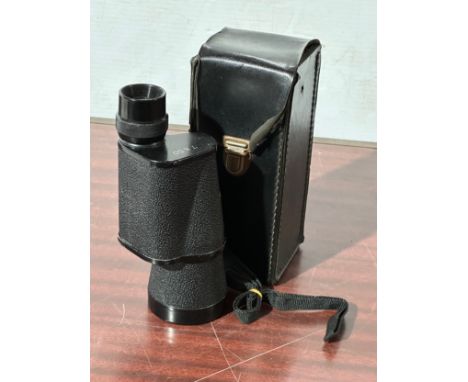 A pair of vintage monoculars and case.