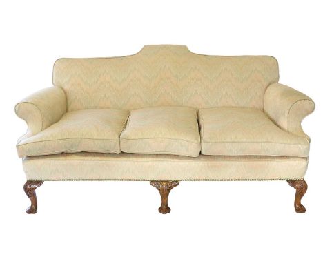 A George III-Style Three-Seater Sofa, recovered in pink, green and cream geometric fabric, with rounded arms and three squab 