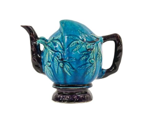 A Chinese Turquoise and Aubergine-Glazed Cadogan Teapot, Qing Dynasty, modelled as a peach with crabstock spout and handle18c