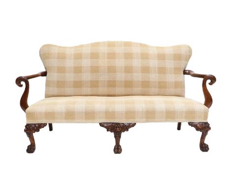 An Irish George III-Style Carved Mahogany Two-Seater Sofa, late 19th/early 20th century, recovered in yellow and cream checke