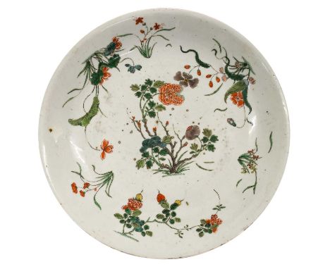 A Chinese Porcelain Dish, Kangxi, painted in famille verte enamels with flowering branches and sprigs35cm diameterChipping an