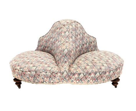 A Victorian Walnut-Framed Three-Seater Conversation Sofa, late 19th century, recovered in pink, cream and blue geometric fabr