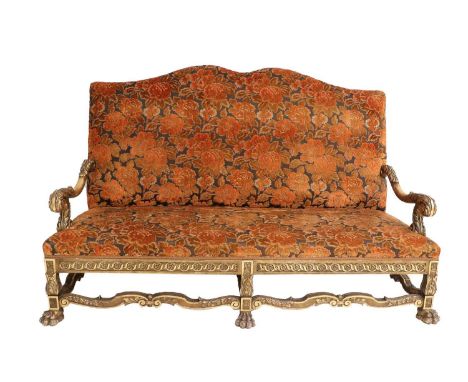 A Victorian Carved Giltwood Hump-Back Sofa, late 19th/early 20th century, recovered in orange and black cut velvet, with acan