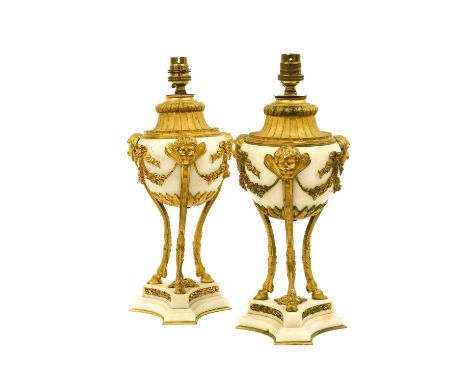 A Pair of Gilt Metal Mounted White Marble Lamp Bases, in Louis XVI style, of ovoid form with fluted shouldered and winged mas
