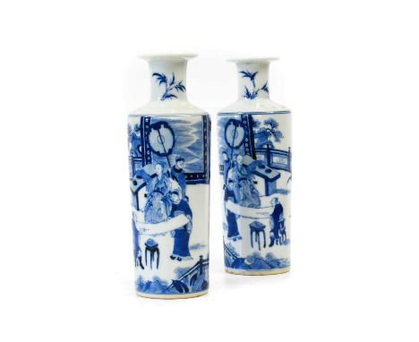 A Pair of Chinese Porcelain Small Rouleau Vases, Kangxi, of cylindrical form with flared neck, painted in underglaze blue wit