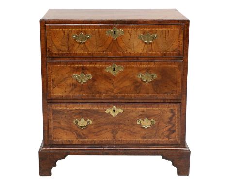 A George II Figured Walnut, Crossbanded and Featherbanded Straight-Front Chest of Drawers, mid 18th century, the moulded cadd