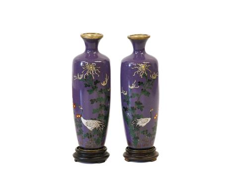 A Pair of Japanese Cloisonne Enamel Vases, Meiji period, of slender baluster form with flared necks, worked in colours with c