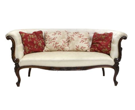 A Late 19th Century French Carved Walnut Two-Seater Sofa, recovered in cream floral silk damask, with overstuffed back suppor