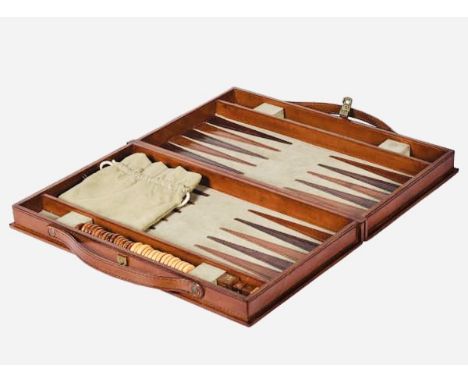 TRAVELLING BACKGAMMON SET, tan leathered case, 23cm H x 40cm W x 7cm D.