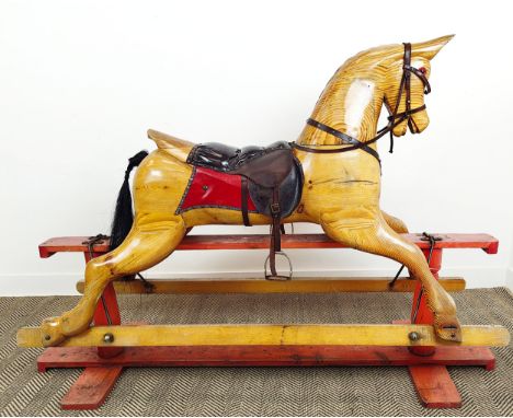 ROCKING HORSE, vintage pine and leather on painted base, 126cm H x 183cm L x 56cm W.