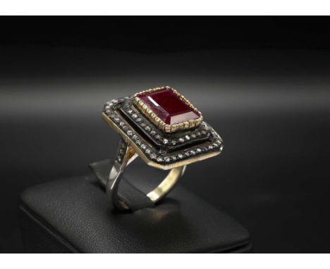 LARGE VINTAGE STYLE STEP-CUT RUBY AND DOUBLE DIAMOND FRAME RING IN SILVER GILT, ruby 5.21ct, rose-cut diamonds 0.58ct.
