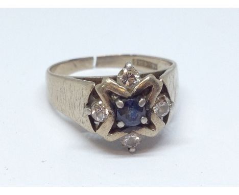 A diamond and sapphire cluster ring marked '18ct GOLD', band cut, gross wt. 4.4g, approx. size J/K.  