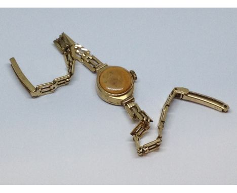 A ladies hallmarked 9ct gold Rotary wristwatch with 9ct gold strap, as found, gross wt. 12g.  