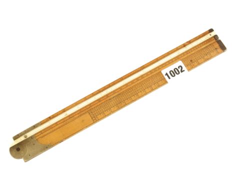 A 2' two fold boxwood and brass Coggeshall slide rule by BLEULER London with ivory slide with Timber Load table, Log scale, G